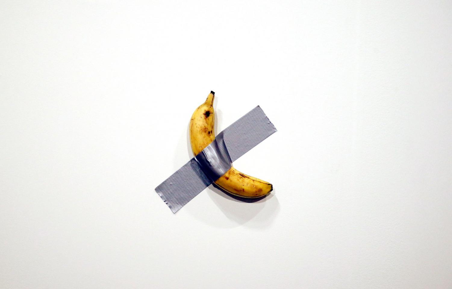 A banana duct-taped to an artist'scanvas